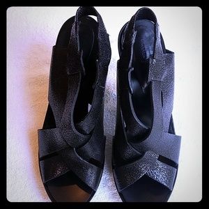 Cracked black leather slip on strap heals.